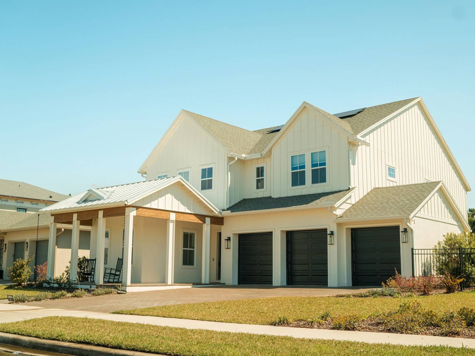 A South Florida single-family home with tile roof and palms